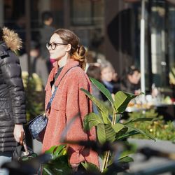 Side view of woman wearing eyeglasses standing outdoors