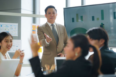 Business colleagues working at office