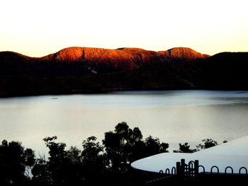 View of calm lake against mountain range