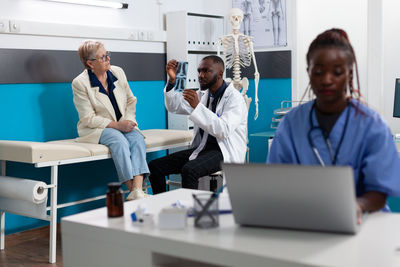 Doctor examining x-ray image of patient at clinic