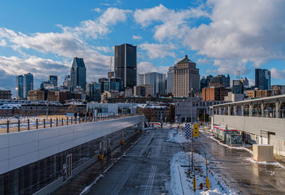 Modern buildings in city against sky