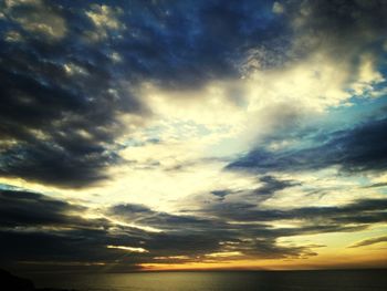 Scenic view of sea against dramatic sky