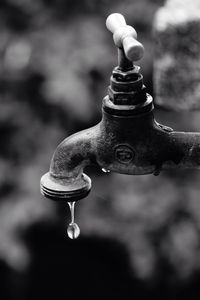 Close-up of water drops on faucet