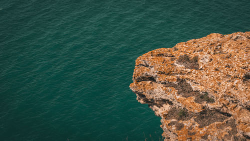 High angle view of rock formation in sea