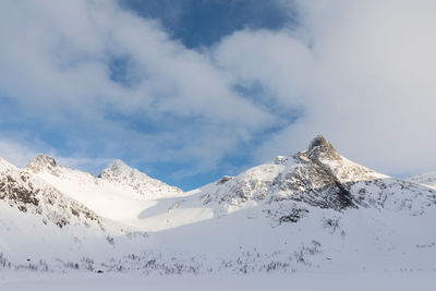 Scenic view of snowcapped mountains against sky