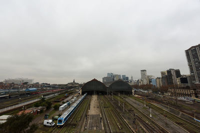 High angle view of railroad tracks amidst buildings in city