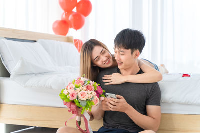 Couple kissing on flower bouquet