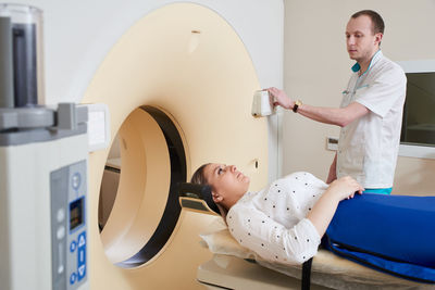 Doctor preparing patient for mri