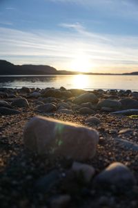 Scenic view of beach against sky during sunset