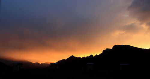 Scenic view of mountains at sunset