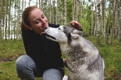 Man with dog in the forest