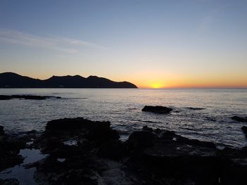 Scenic view of sea against sky during sunset