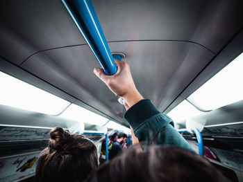 Rear view of people traveling in subway train