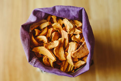 Directly above of dried food in sack on floor