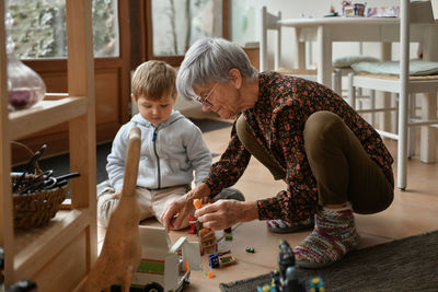 Side view of man working at table