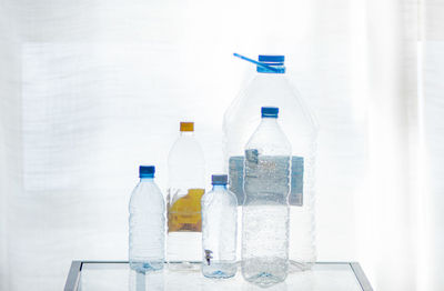 Close-up of wine glass on table against white background
