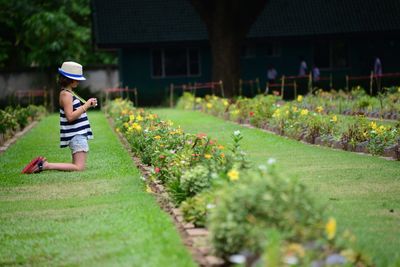 Boy standing on grassy field