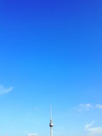 High section of berlin tv tower against blue sky