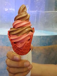 Close-up of woman holding ice cream cone