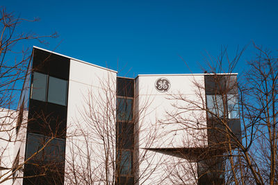 Low angle view of building against clear blue sky