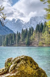 Scenic view of lake and mountains against sky