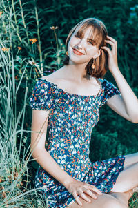 Beautiful young woman lying on land