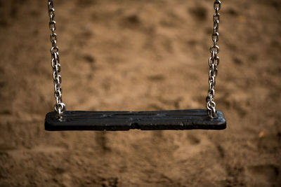 Close-up of swing at playground