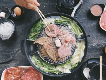 High angle view of person preparing food on table