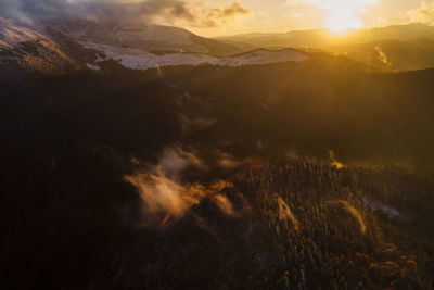 Scenic view of mountains against sky during sunset