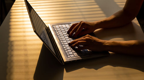 High angle view of person using laptop