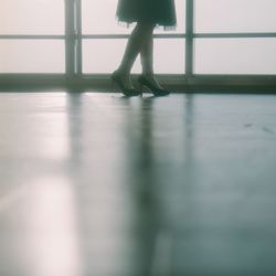 Close-up of woman standing on floor