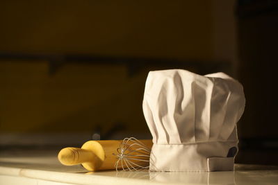 Close-up of white tied on table