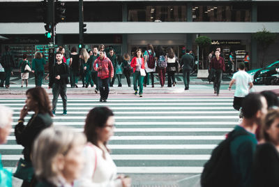 People walking on street in city