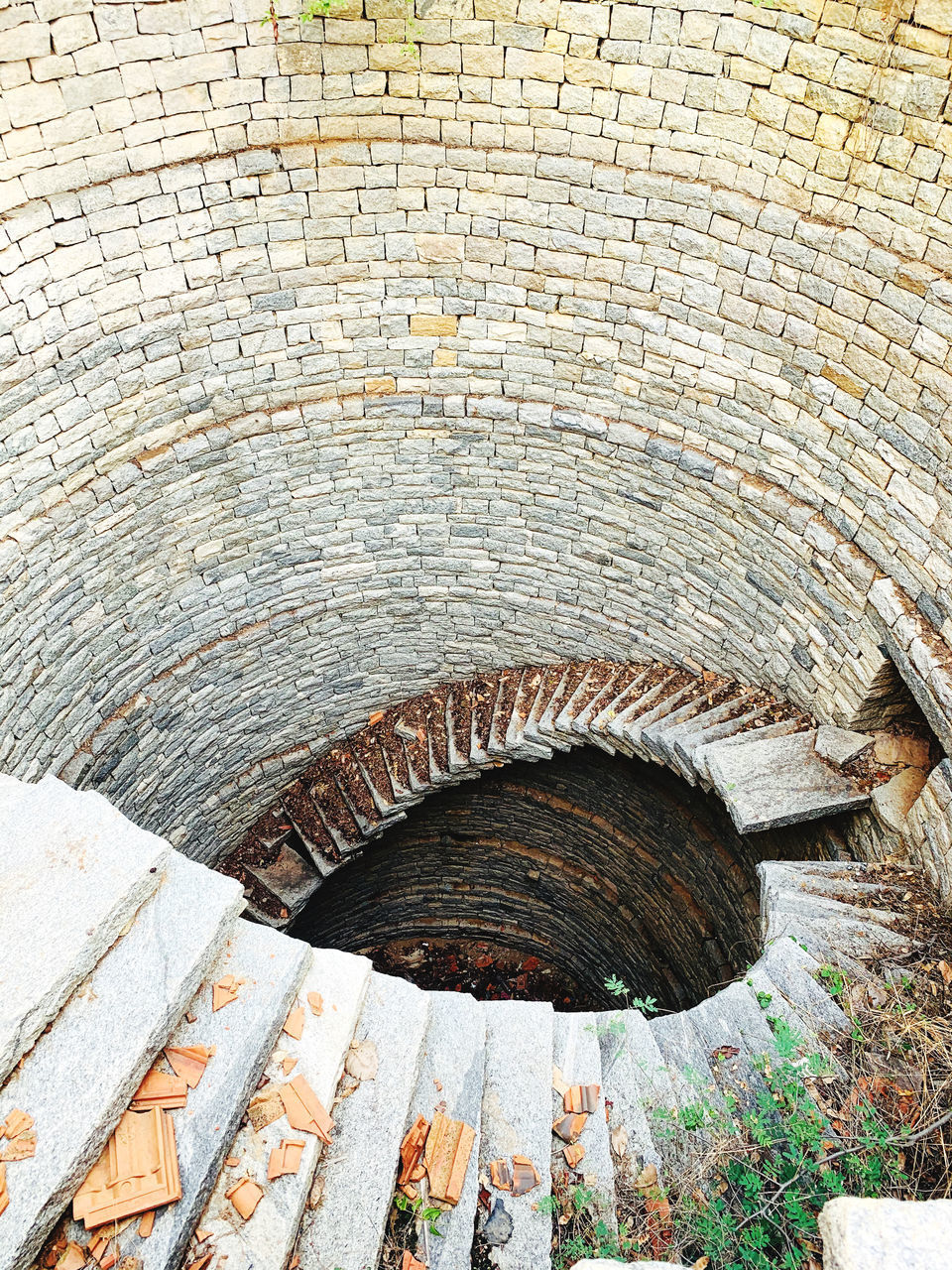 HIGH ANGLE VIEW OF STONE WALL IN OLD TUNNEL