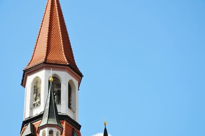 Low angle view of building against clear blue sky