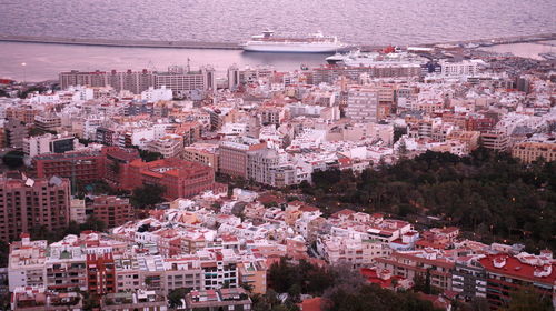 High angle view of town by sea