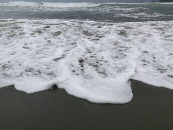 Scenic view of frozen beach