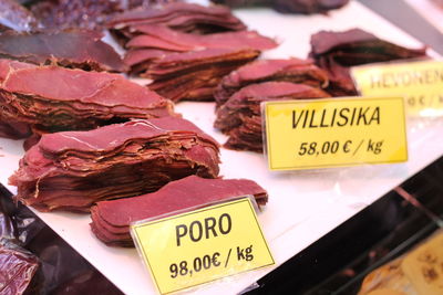 Close-up of information sign for sale