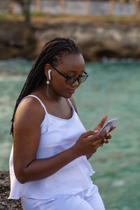 Young woman using mobile phone