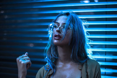 Close-up of young woman smoking outdoors