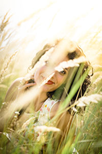 Portrait of smiling young woman on field