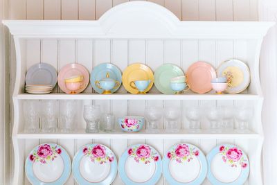 Close-up of colorful crockeries on shelves