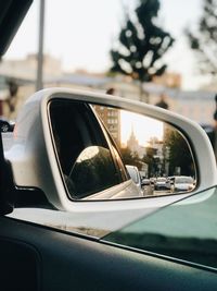 Reflection of car on side-view mirror