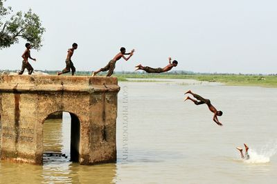 Woman jumping in water