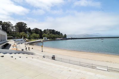 Scenic view of swimming pool by sea against sky