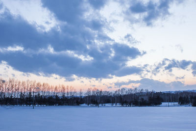 Scenic view of snow covered landscape against sky