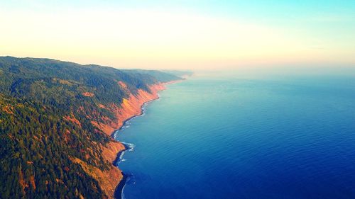 Scenic view of sea against sky at sunset