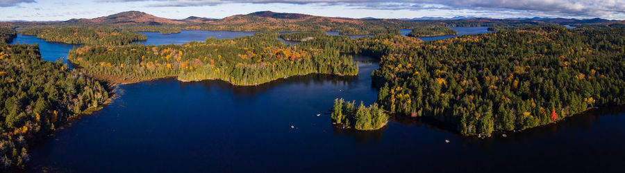 Panoramic view of lake and mountains against sky