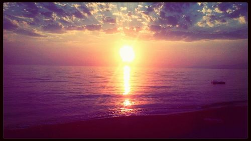 Scenic view of sea at sunset