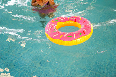 High angle view of text floating on swimming pool